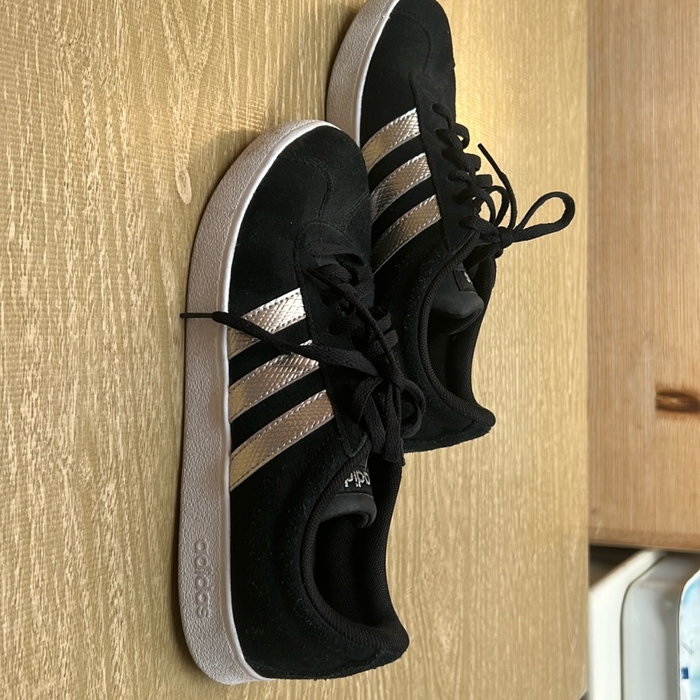 Adidas suede with rose gold stripes.